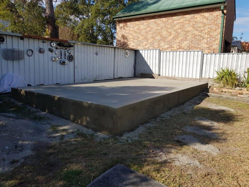 Shed Flooring - Concrete slab, finished sloping site by New Look Shed City