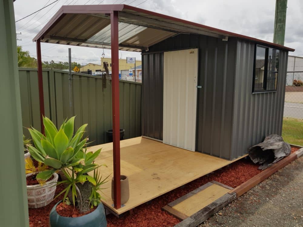 Custom Colorbond Garden Sheds built and installed by New Look Shed City. Deluxe 2.34 x 2.34 gable with a 2.34 awning in Woodland Grey, Surfmist, Manor Red and a window.