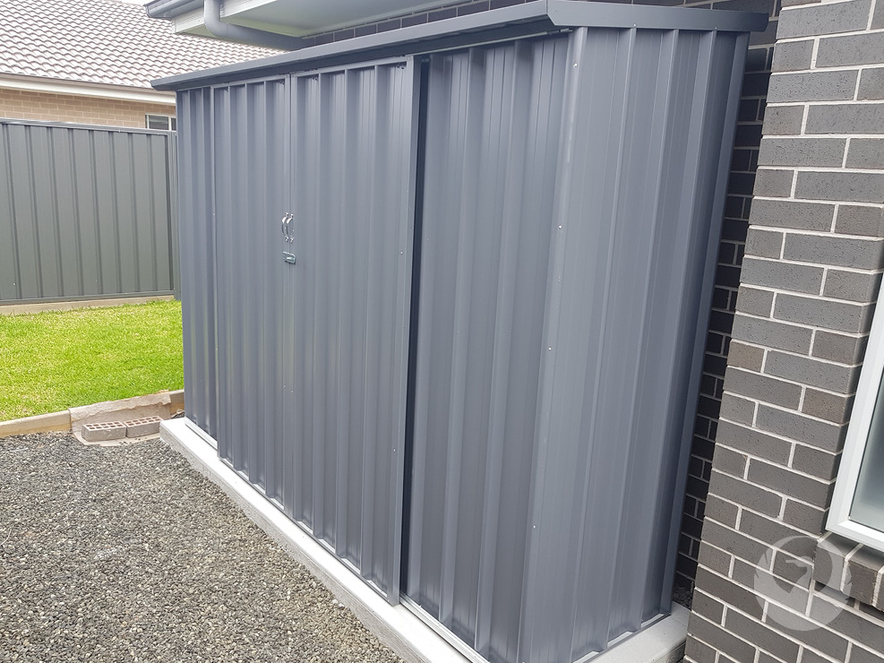 Custom Colorbond Garden Sheds built and installed by New Look Shed City. Deluxe 3.10 x 0.81 skillion shed with double sliding doors in Basalt & Basalt trim.