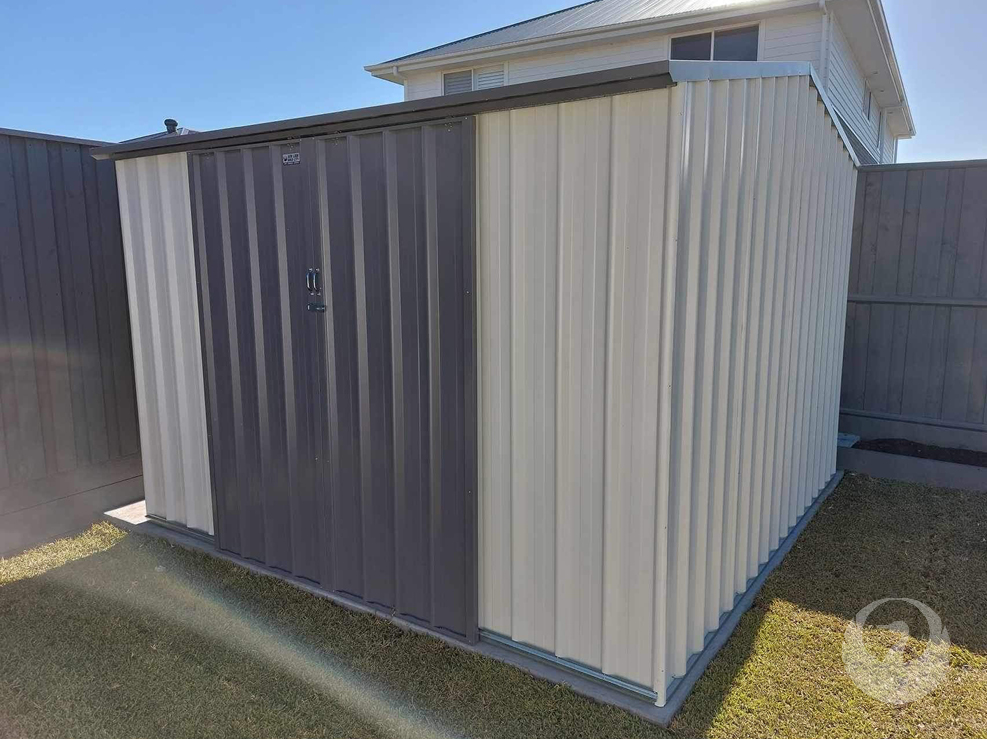 Custom Colorbond Garden Sheds built and installed by New Look Shed City. Deluxe 3.10 x 3.10 gable shed in Surfmist with double sliding doors in Monument.