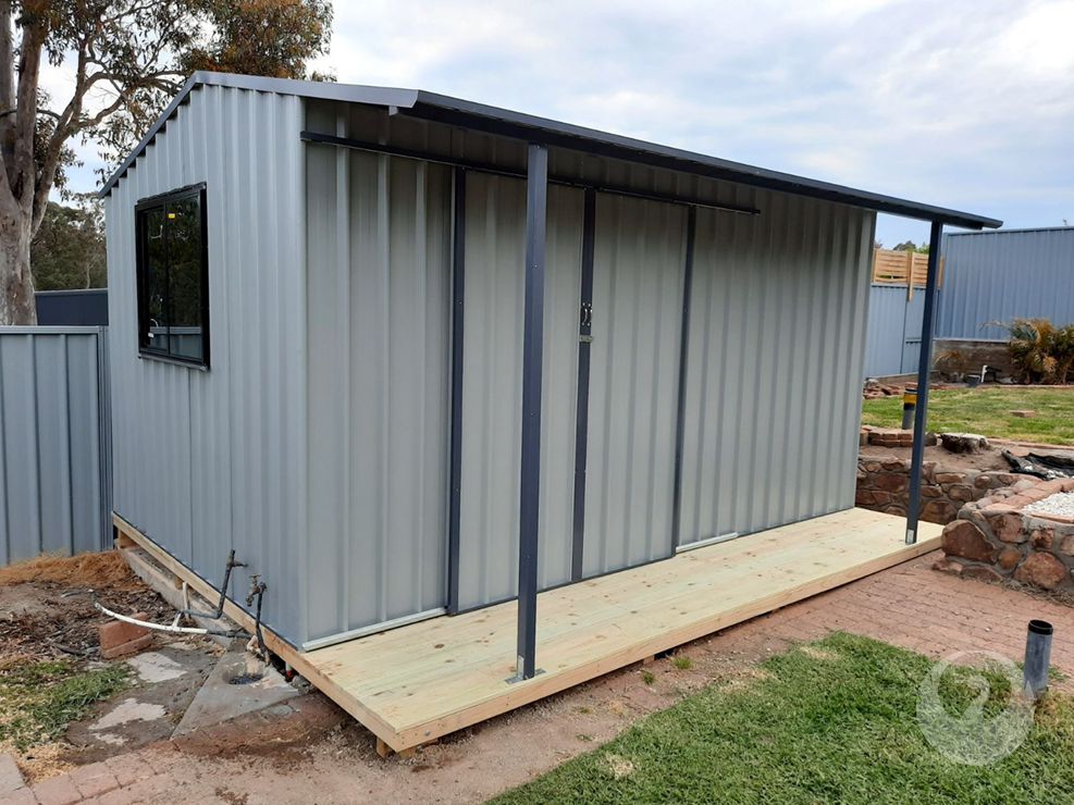 Custom Garden Sheds built and installed by New Look Shed City. Deluxe 5.370 x 3.100 shed with a 0.81 awning, double sliding doors and window in Windspray and Ironstone trim.