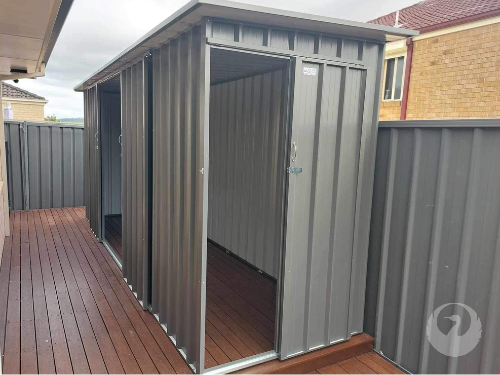 Custom Colorbond Garden Sheds built and installed by New Look Shed City. Deluxe 5.37 x 1.58 skillion roof shed featuring a single and double sliding doors in Woodland Grey.
